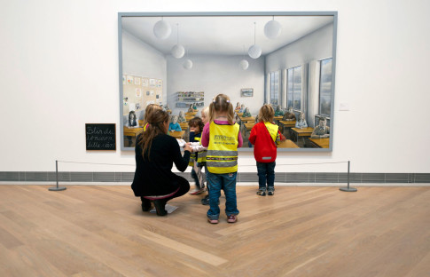 Group of children in front of painting.