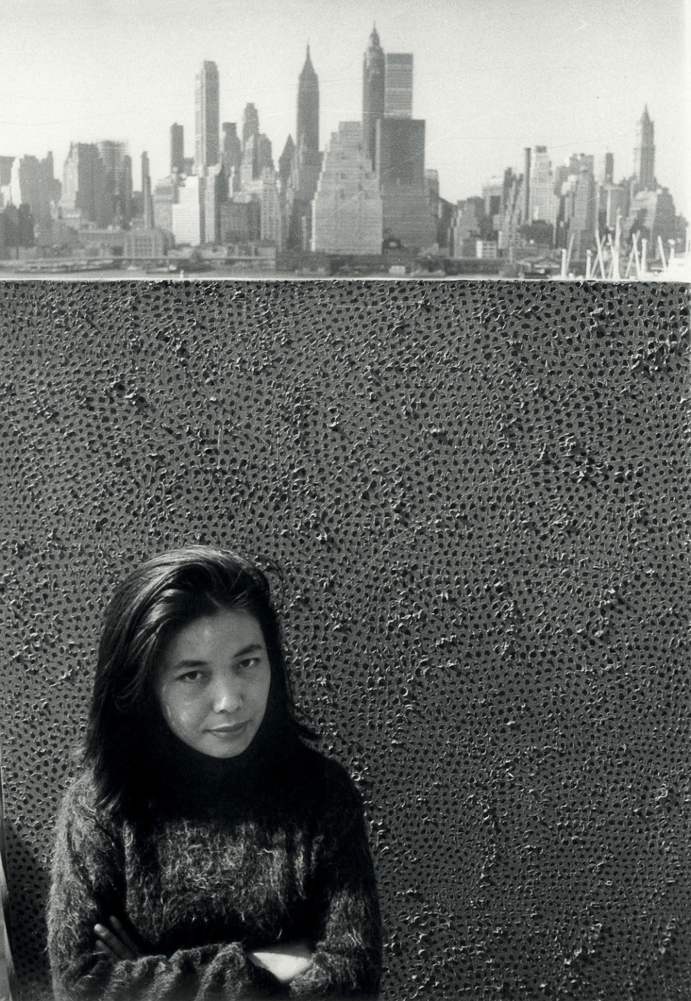 Yayoi Kusama with one of her Infinity Net paintings in New York, c. 1961.