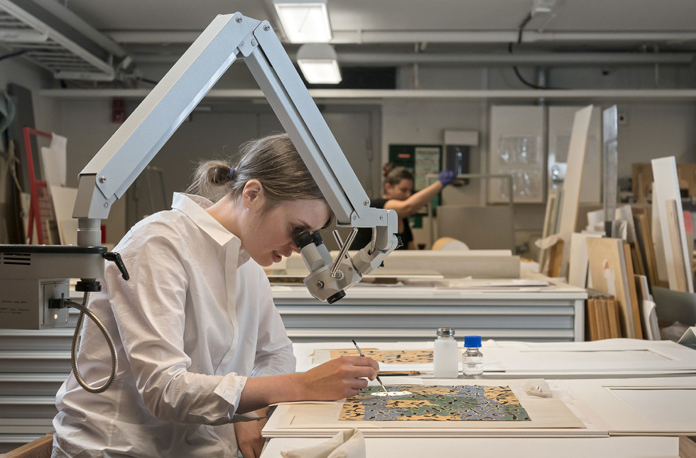 The conservatory studio with conservator at work.