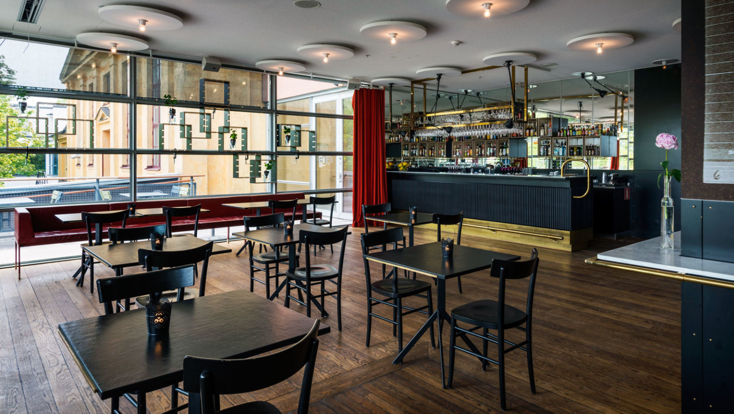 Tables and chairs in front of the bar