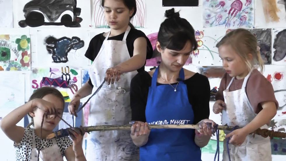 Art Educator Rebecka Stone with children.