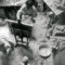 Black and white photograph of Giacometti painting in his studio
