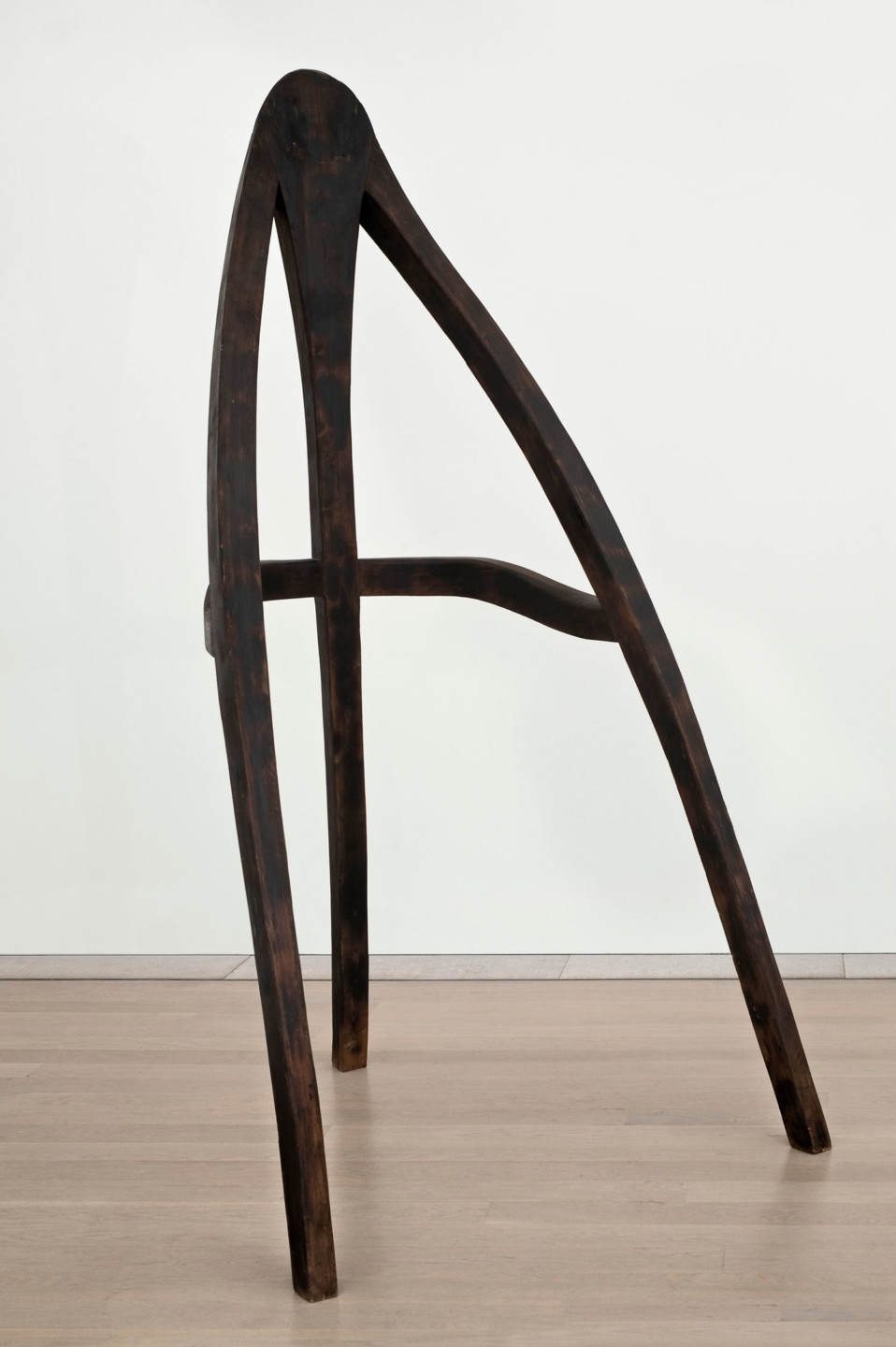  A work by Björn Lövin. Tarred wood.