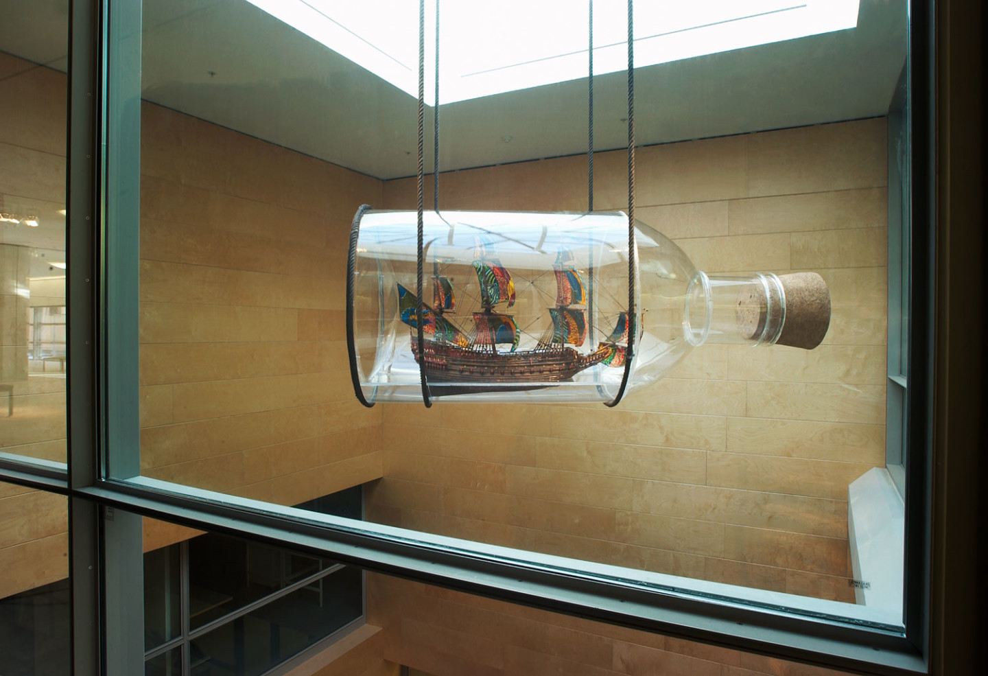 The ship Vasa in a large glass bottle that hangs in the museum's foyer