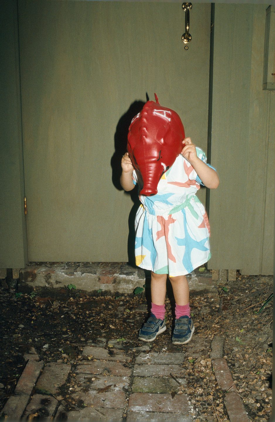 A child with an elephant mask