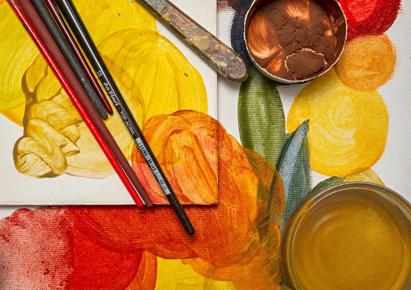 Tempera painting, different colors: green, yellow, red. Paintbrushes.