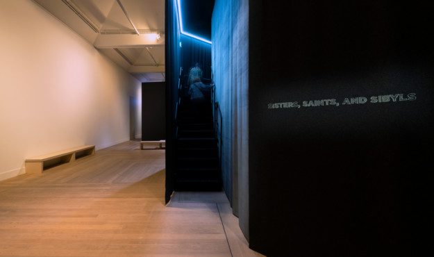 people go up a flight of stairs in "Nan Goldin – This Will Not End Well"