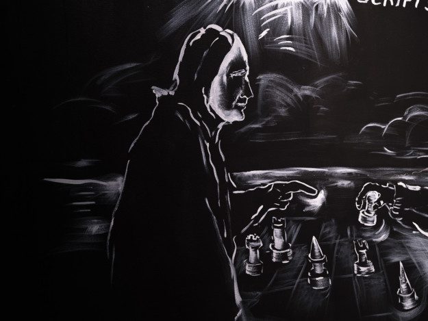 White paintings on a black wall