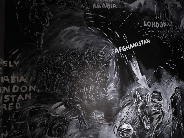 White paintings on a black wall