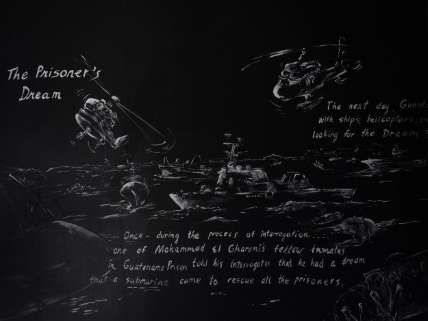 White paintings on a black wall