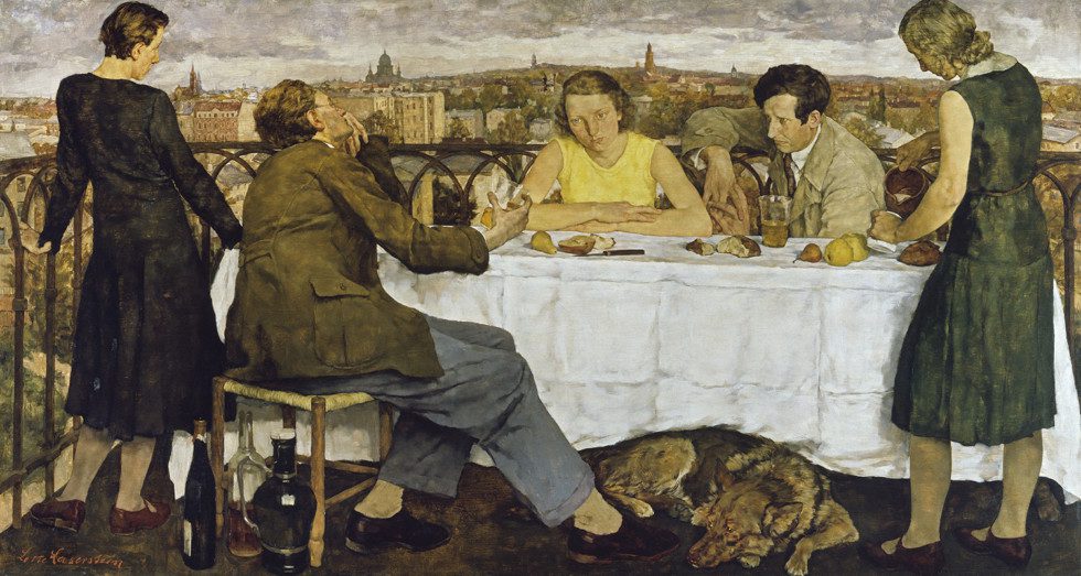 Five people sit at a table