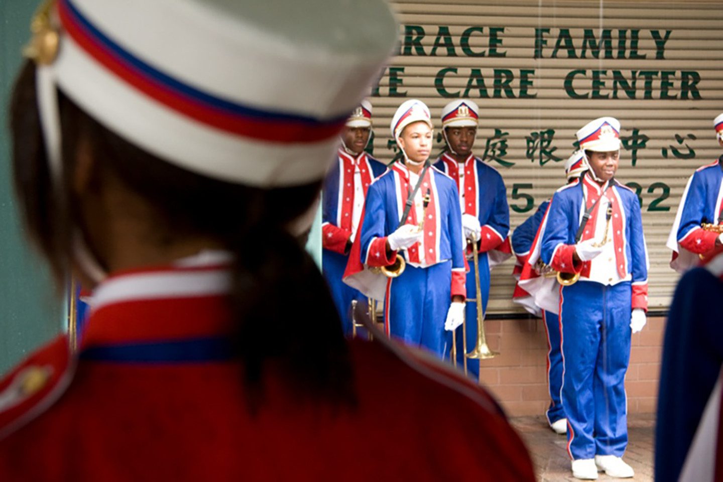 film still, children in marching band uniforms and musical instruments