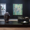 installation view with paintings and sculptures on floor