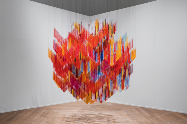 A hanging artwork with vibrant colors