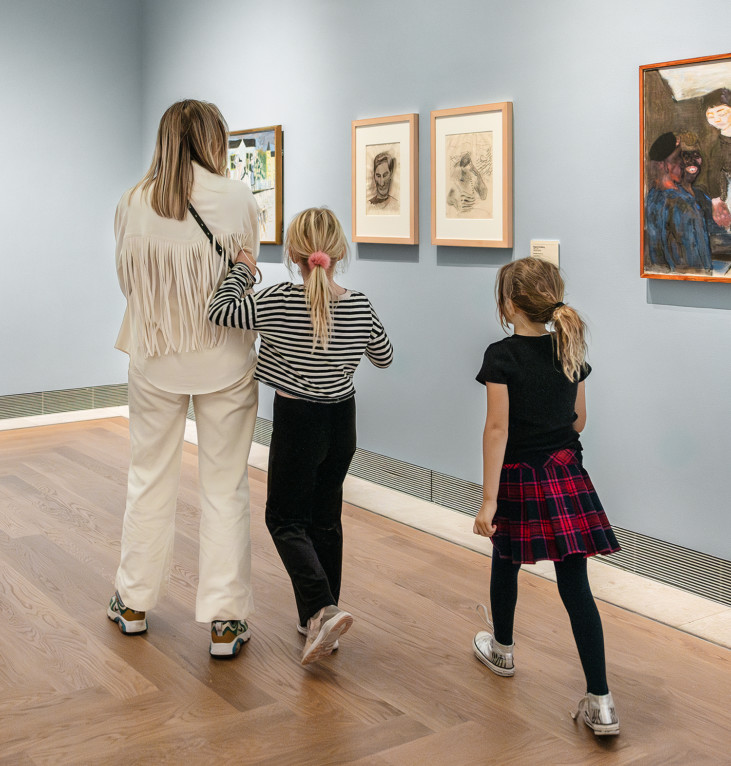 Parent and children in the exhibition space 